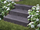Blockstufen Basalt Takeda mit Blumen und Gras