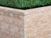 Mauersteine Travertin Noce Rustic mit Gras