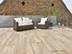 Dachterrasse mit Lounge-Möbeln und Terrassenplatten in Holzoptik Canada Lodge