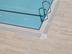 Pool mit Travertin Natura als Poolumrandung von oben fotografiert